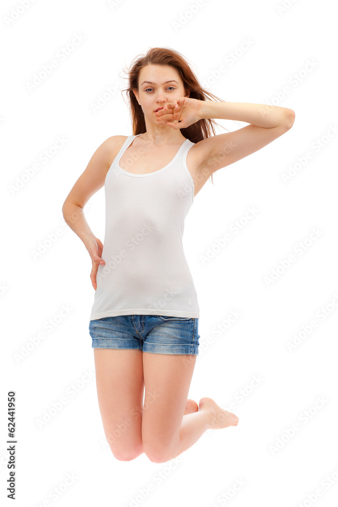 Girl in a white shirt and blue shorts on a white background. Girl in a white shirt and blue shorts on a white background.