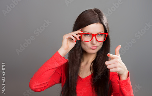 Fotografija Skeptical woman pointing at camera