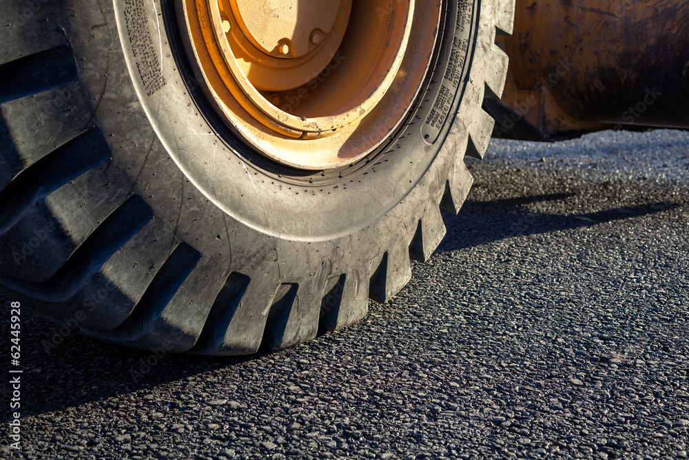Close-up excavator tire in the road Close-up excavator tire in the road