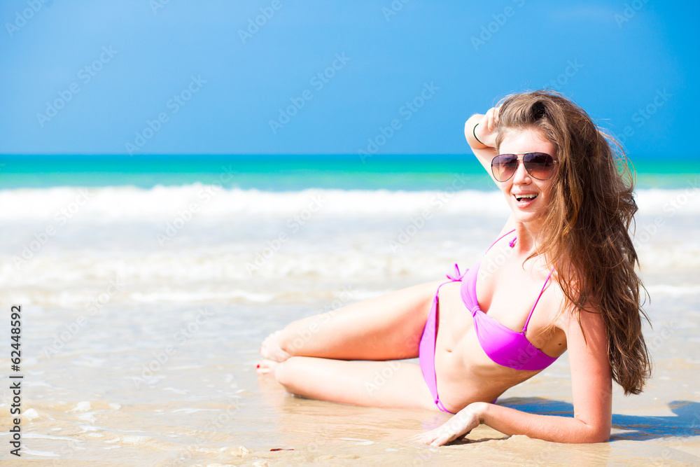 long haired woman in bikini on tropical beach long haired woman in bikini on tropical beach