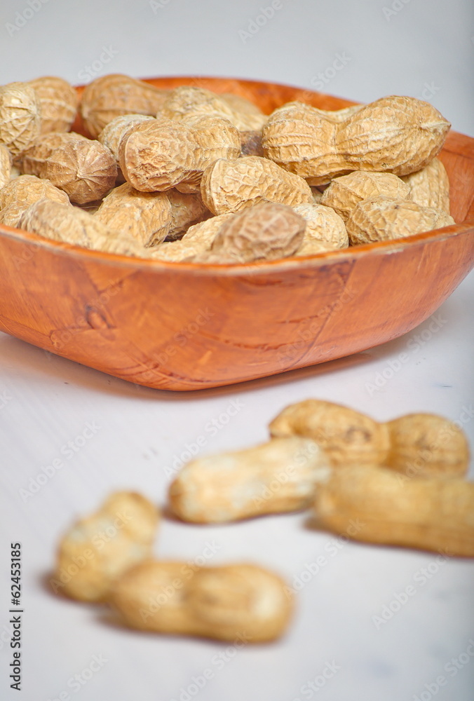 Peanuts in a brown bowl Peanuts in a brown bowl
