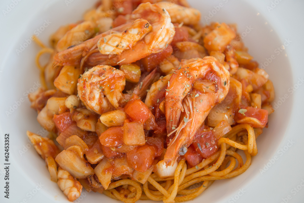 plate of spaghetti and tomato sauce and prawn
