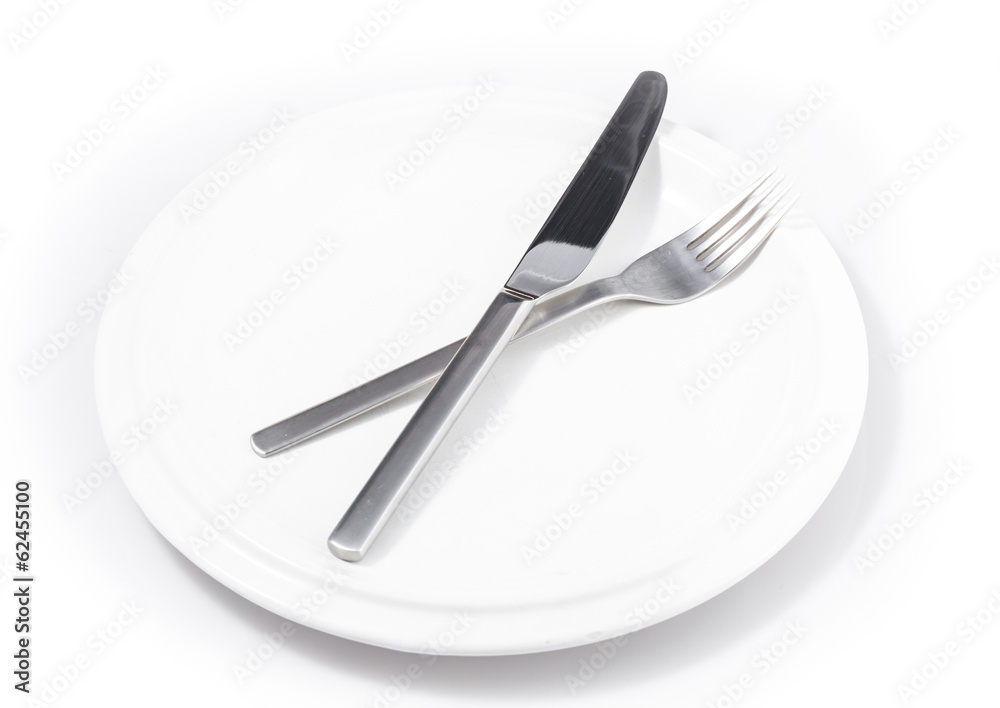 fork and knife in plate isolated on a white background fork and knife in plate isolated on a white background
