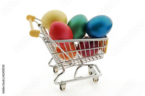 Small shopping cart with colored easter eggs