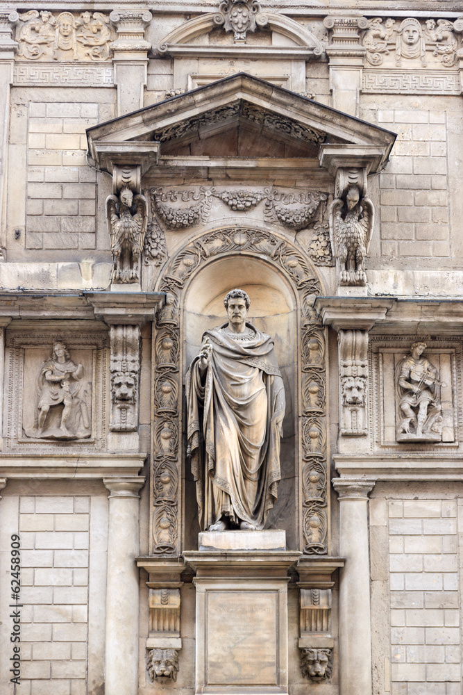Medieval statue on the building in Milan