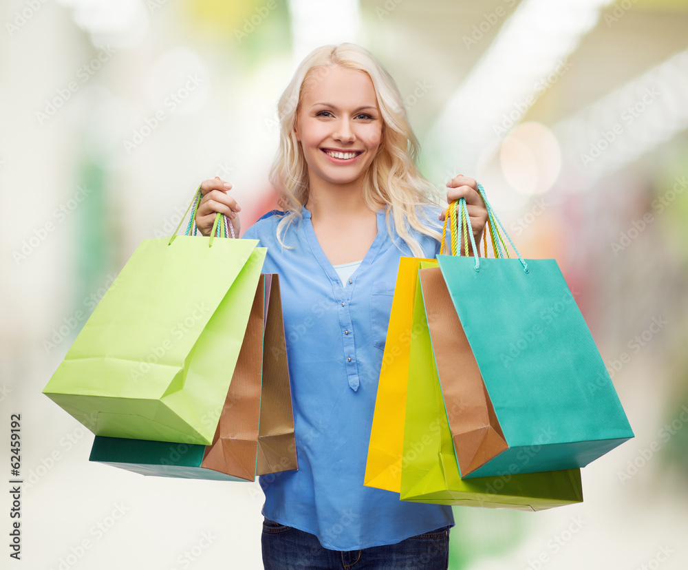 smiling woman with many shopping bags smiling woman with many shopping bags