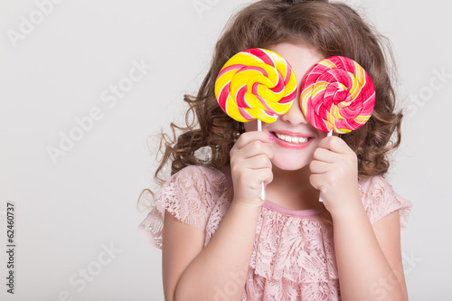 Funny child eat candy lollipop Funny baby girl eating sweets