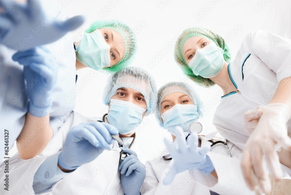 group of doctors in operating room group of doctors in operating room