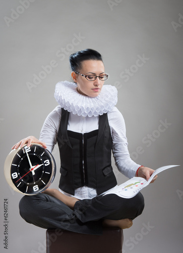 Fototapeta Lady in ruff collar with a clock reading the document