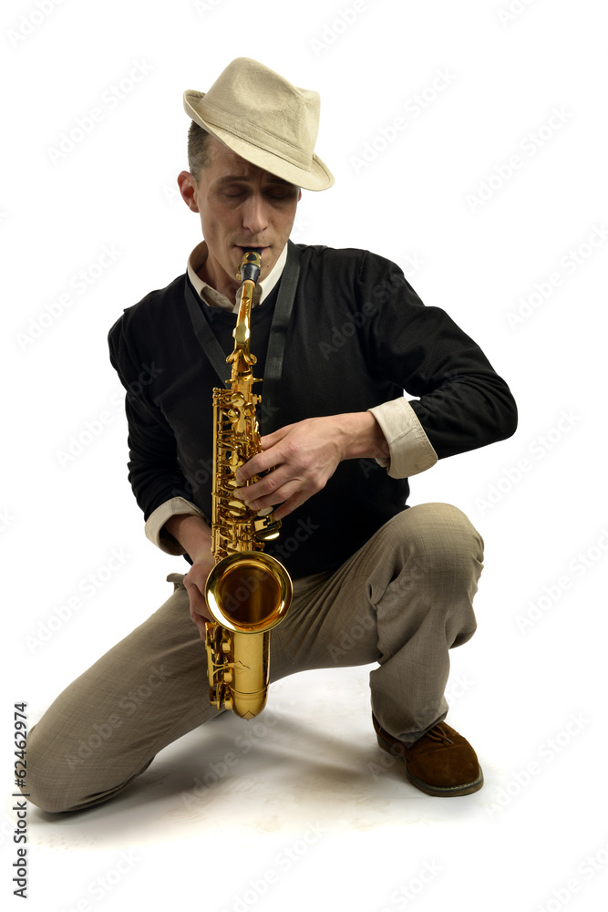Naklejka premium young man playing saxophone