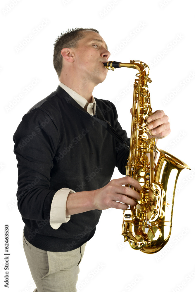 Obraz premium young man playing the saxophone