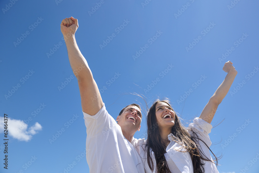 happy couple have fun on the beach happy couple have fun on the beach