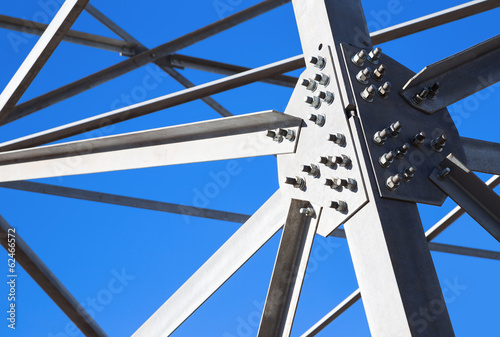 Steel beams against the blue sky. Fragment metal framework. photo