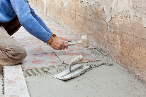 Tiler works with flooring