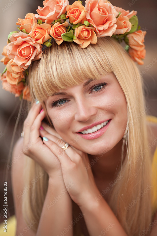 Beautiful young woman with spring flowers wreath Beautiful young woman with spring flowers wreath