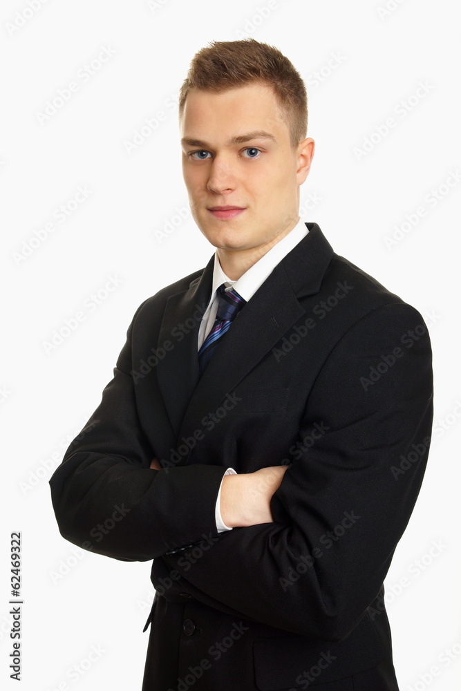 Handsome young businessman standing at suit Handsome young businessman standing at suit