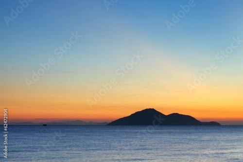 Sunset seascape with small island