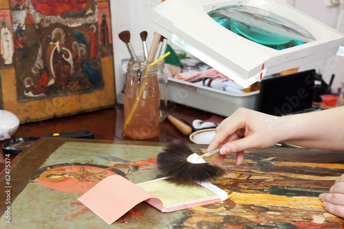  restoration of old icon with gold leaf photo