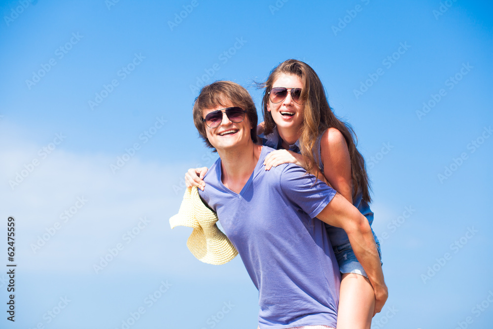 Closeup of happy young couple in sunglasses smiling. Closeup of happy young couple in sunglasses smiling.