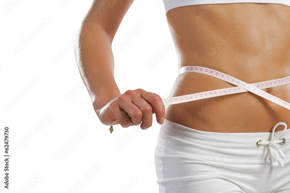 young athletic woman measuring waist young athletic woman measuring waist