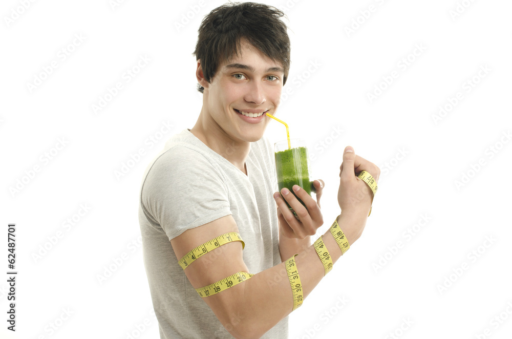 Man measuring his biceps with centimeter while drinking smoothie Man measuring his biceps with centimeter while drinking smoothie