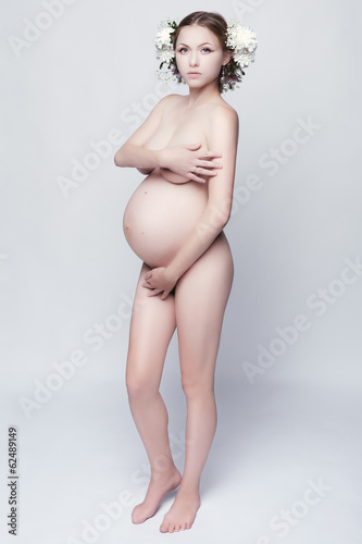 Portrait of a naked pregnant woman.