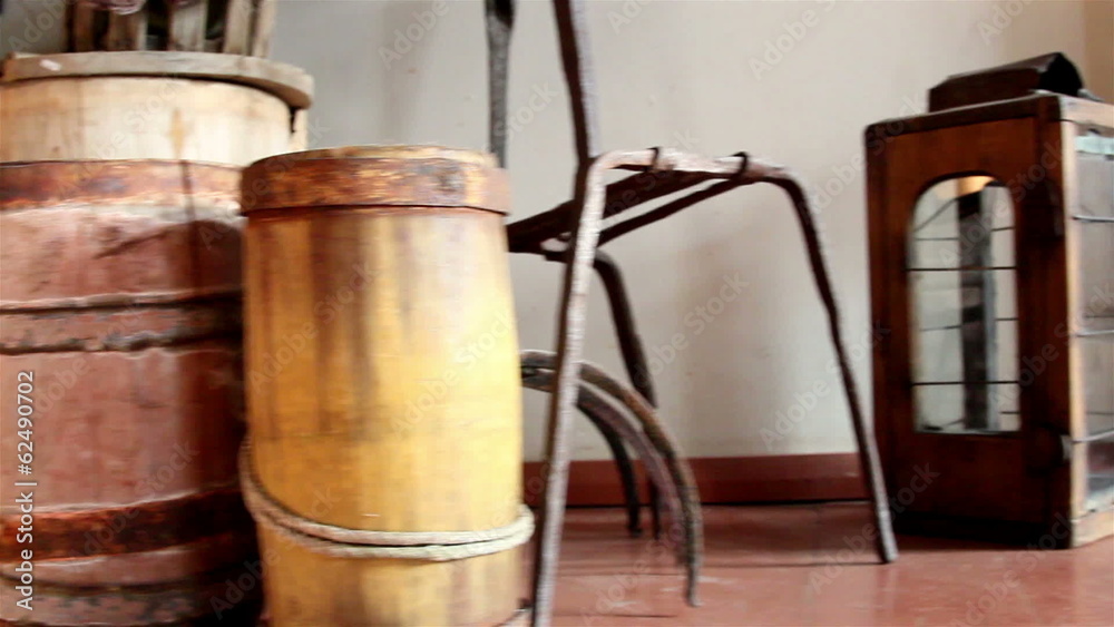 Three wooden barrels and an old lamp Three wooden barrels and an old lamp