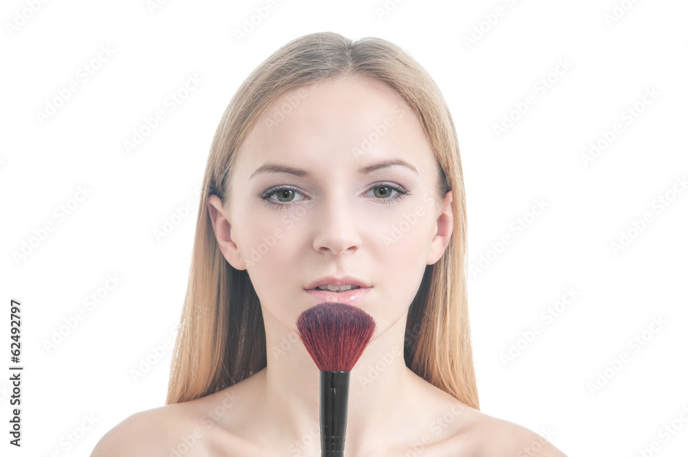Beauty photo of girl with makeup brush.