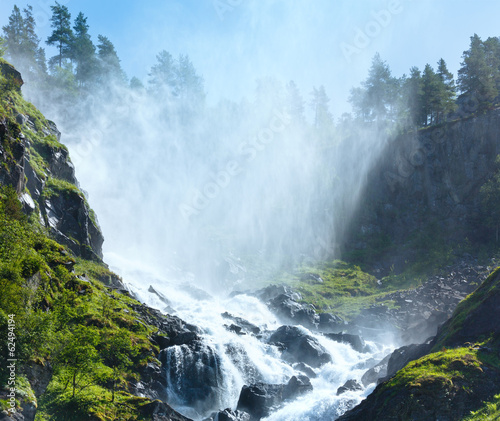 Summer Latefossen waterfall on mountain slope  Norway .