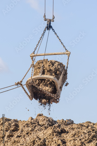 the excavator bucket foreground in operation