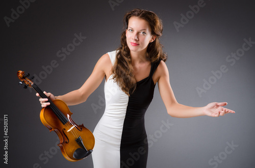 Woman artist with violin in music concept