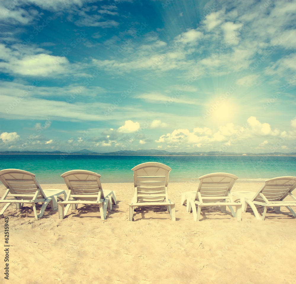 chairs on beach with blue sky for summer holiday vintage retro f