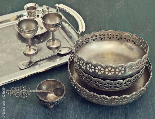 old silver utensils on a tray