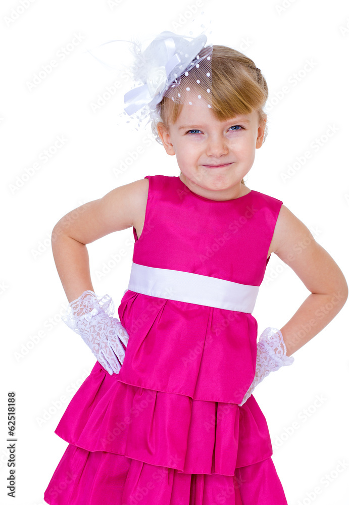 Charming and very fashionable little girl in a red dress and hat