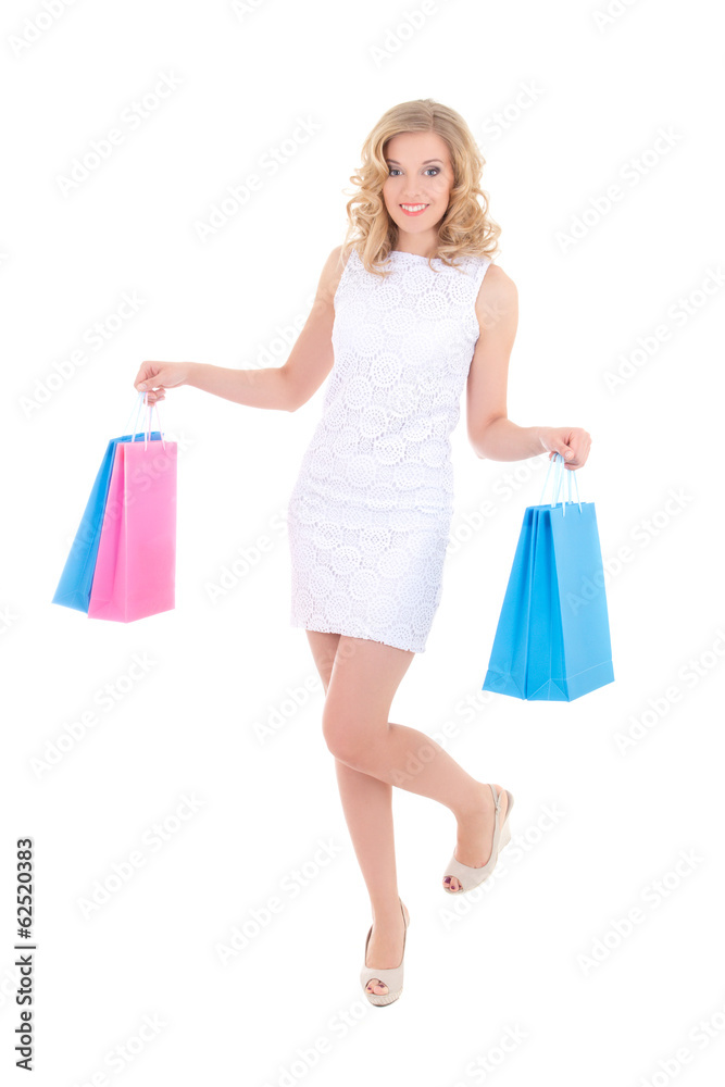 young attractive woman in white dress with shopping bags isolate