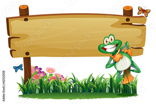 An empty wooden signboard with a playful frog