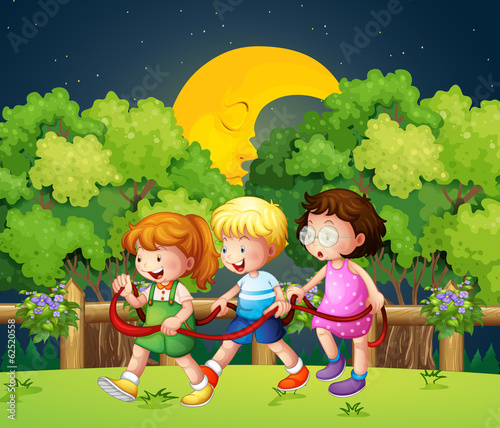 Three kids outdoor walking in the middle of the night