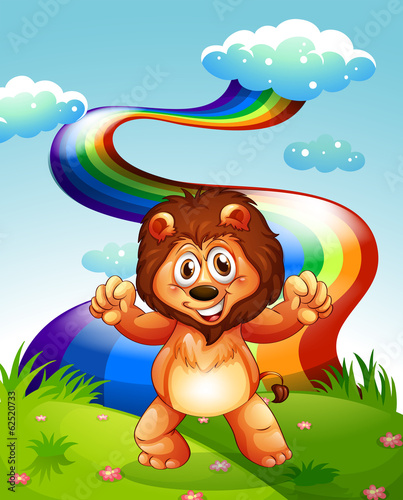 A happy lion at the hilltop with a rainbow in the sky