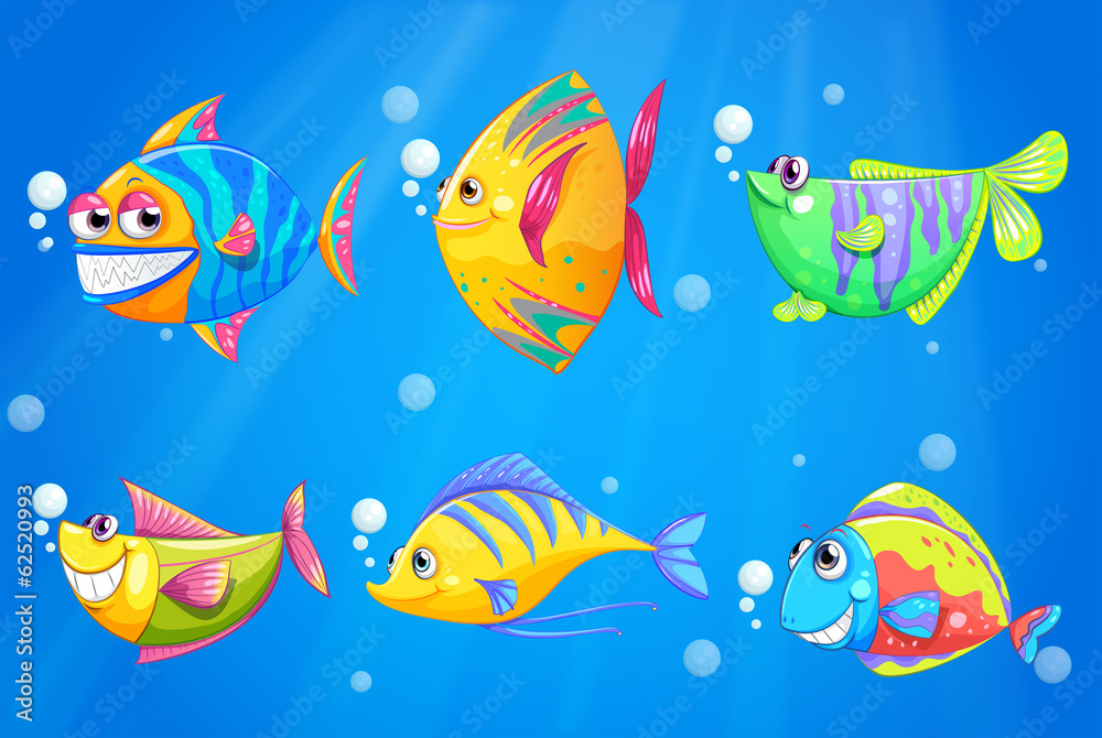 Naklejka premium Colorful and smiling fishes under the sea