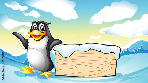 A penguin beside the empty wooden board
