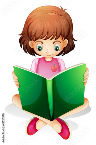 A young girl reading a green book