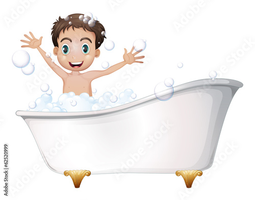 A little boy at the bathtub