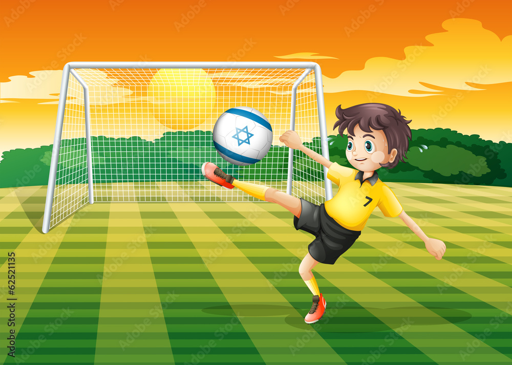 Fototapeta premium A girl kicking the ball with the Israel flag