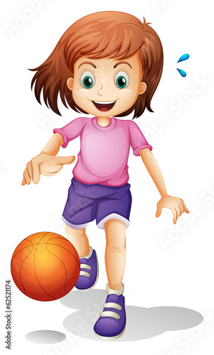 A little girl playing basketball
