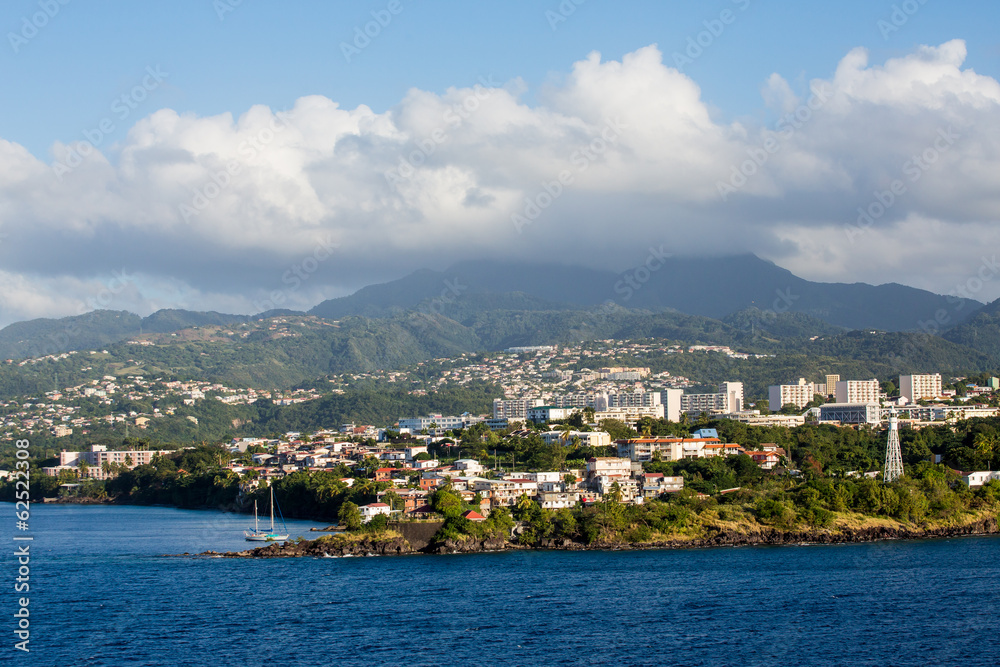 Martinique Resorts Beneath Foggy Mountain