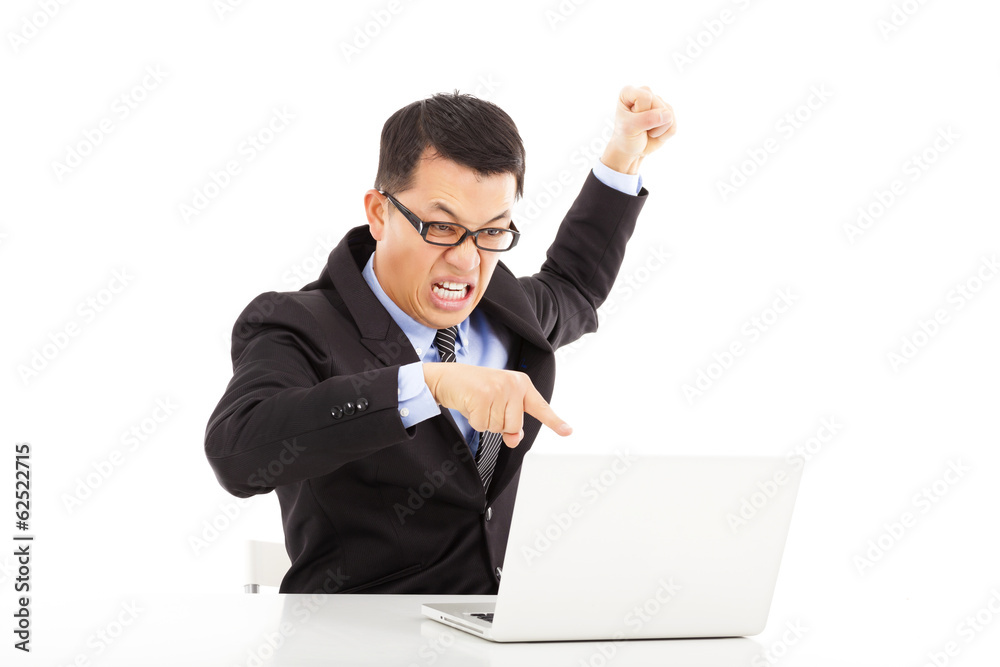 businessman yelling and make a fist with laptop businessman yelling and make a fist with laptop