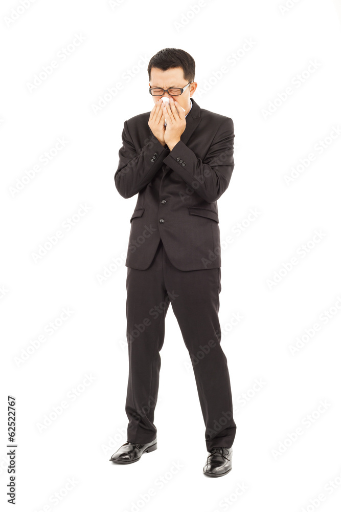 sick young businessman is sneezing with toilet paper sick young businessman is sneezing with toilet paper