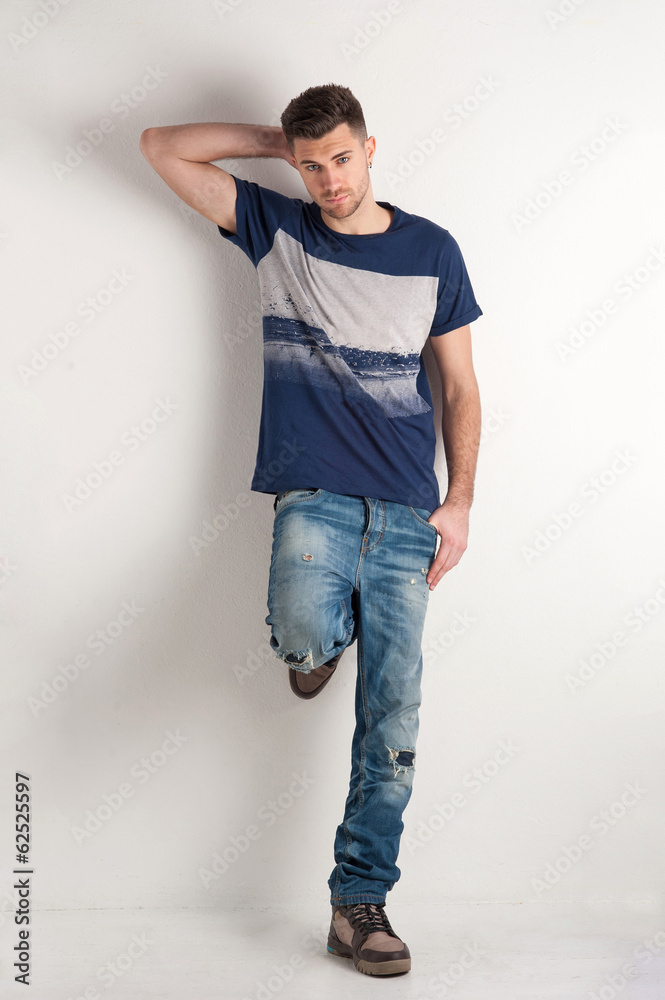 Man full body portrait over white wall background. Man full body portrait over white wall background.
