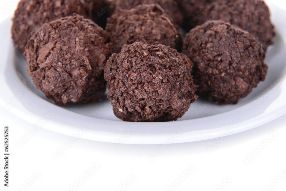 Delicious chocolates on plate close-up Delicious chocolates on plate close-up