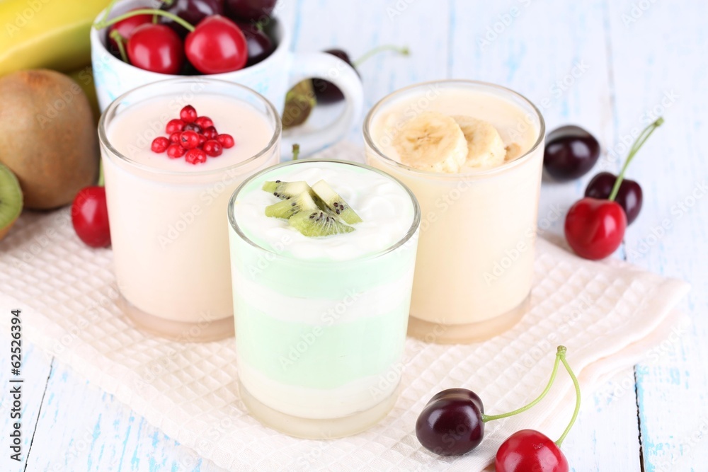 Delicious yogurt with fruits tastes in glasses and fresh fruits Delicious yogurt with fruits tastes in glasses and fresh fruits